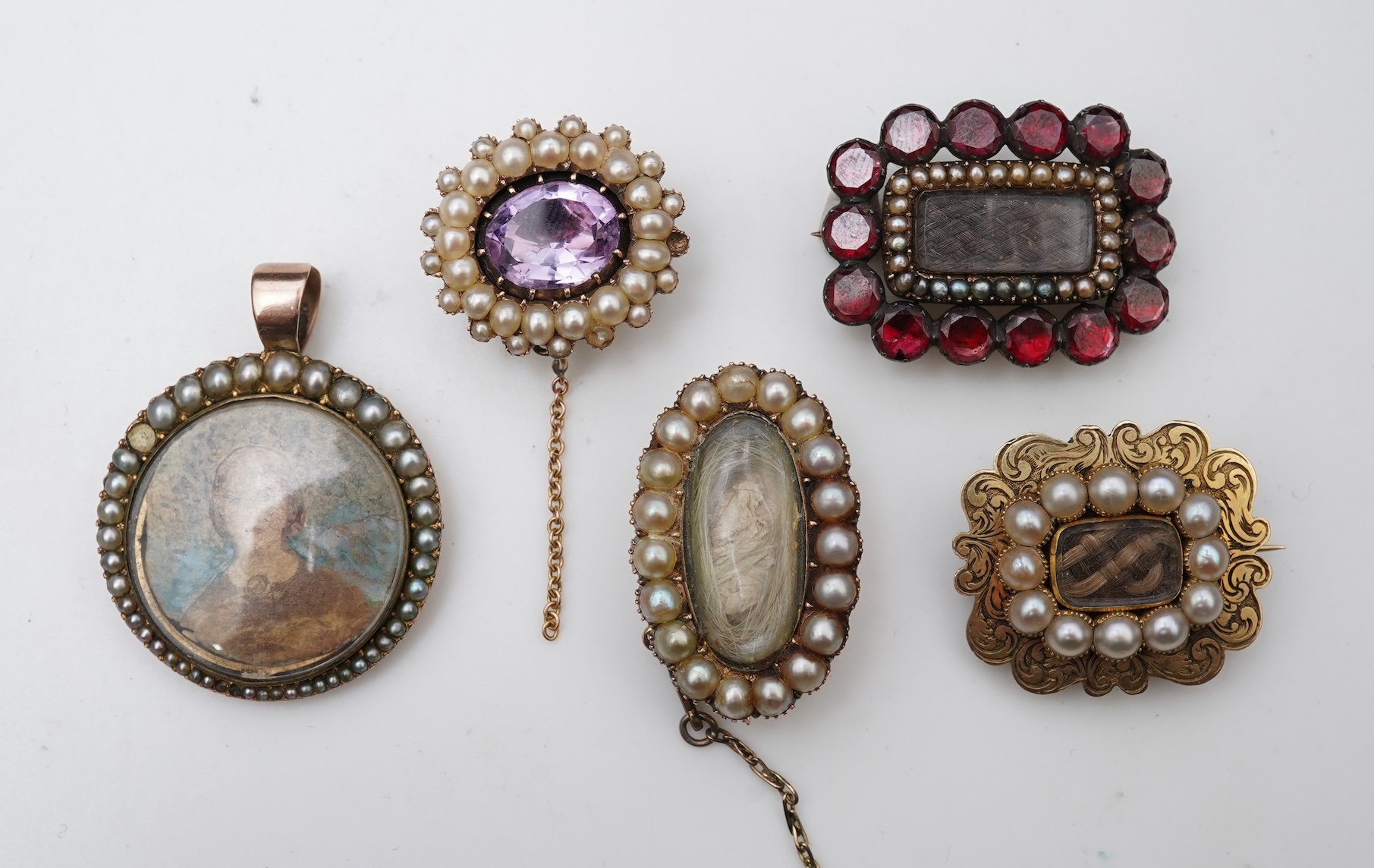 A collection of five Georgian/Victorian brooches, circa 1800-1900